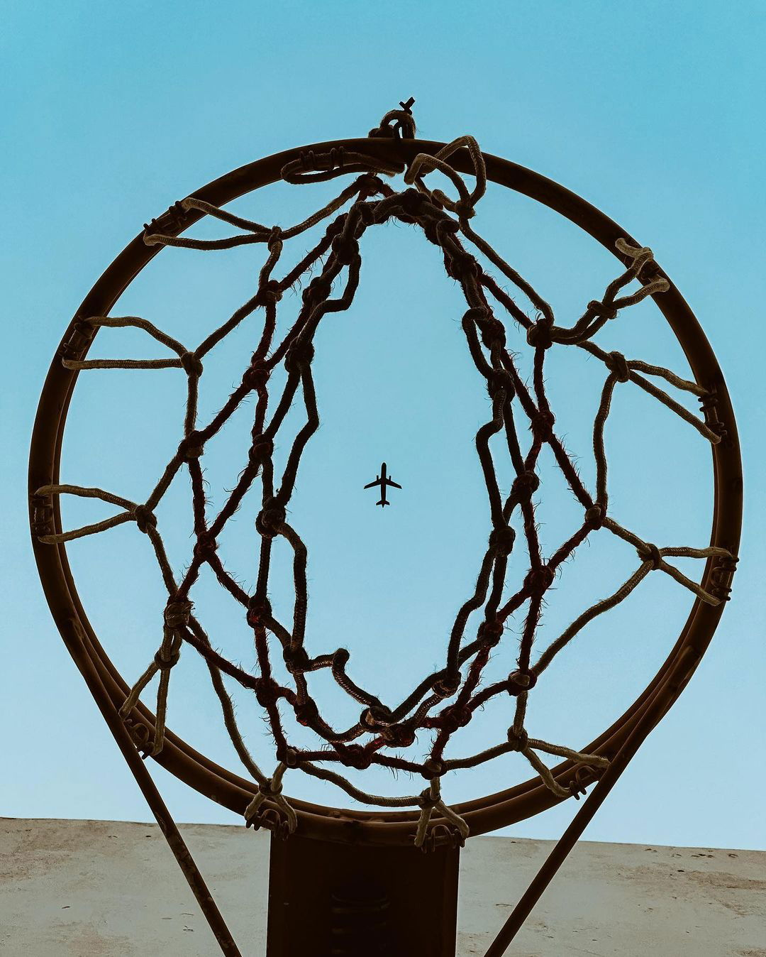 Photo by apple on July 25, 2024. May be an image of basketball, helicopter, backboard, ball, propeller, basketball court and text.